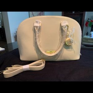 NWOT Joy & Iman Handbag. Brand new Latte color.Inc dust bag and shoulder strap.